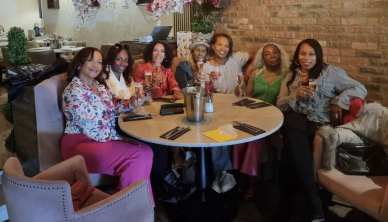 Retreat group celebrating with champagne